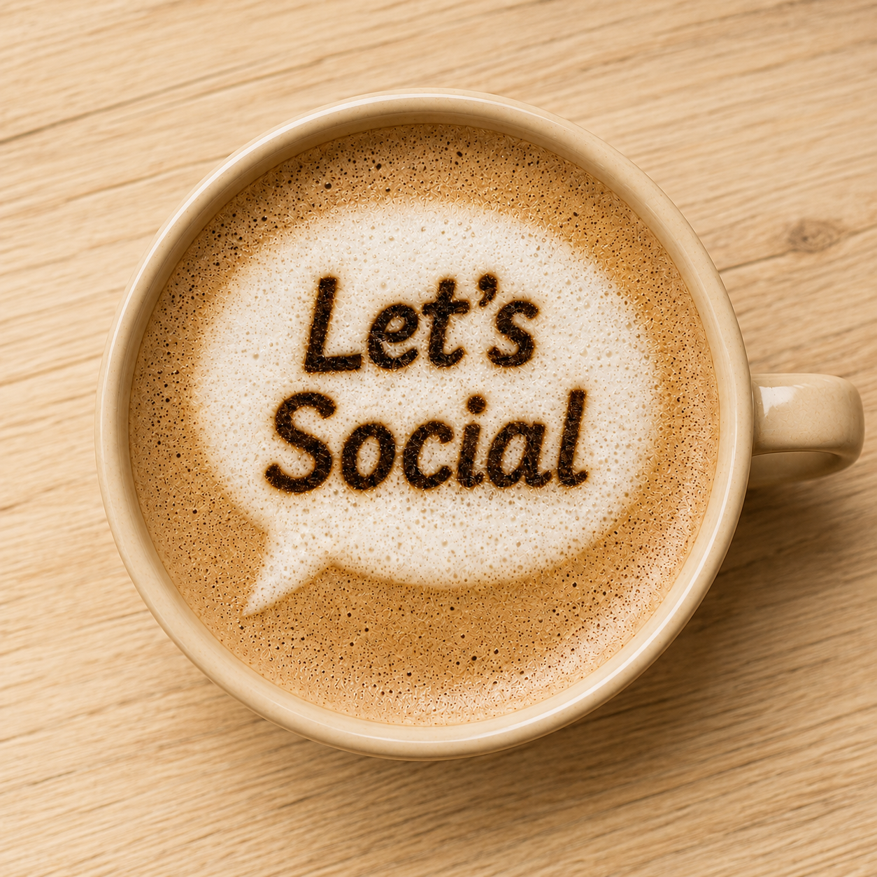 Coffee cup with Let's Social written in foam inside a speech bubble